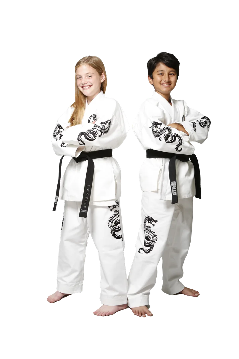 Two Dragon Squad students in white dragon uniforms with black belts, arms crossed and smiling.